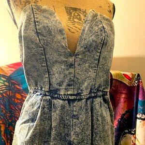 Light blue denim plunge jumpsuit w/ pockets.